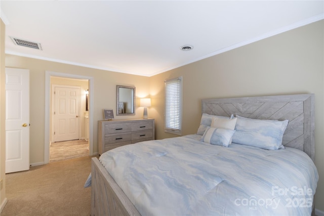 carpeted bedroom featuring baseboards, visible vents, and ornamental molding