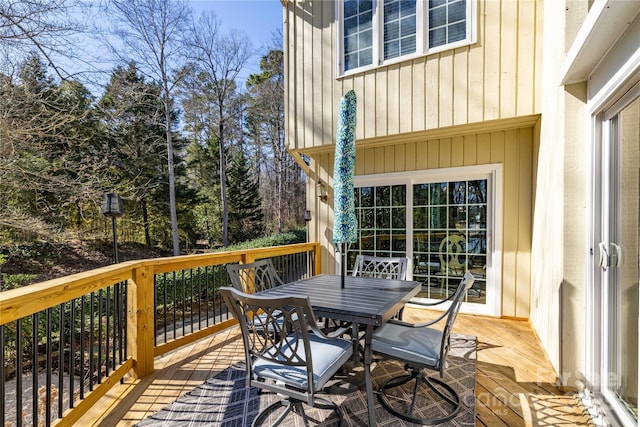 deck with outdoor dining area