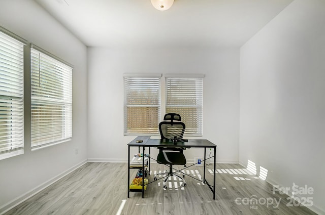 office featuring wood finished floors and baseboards