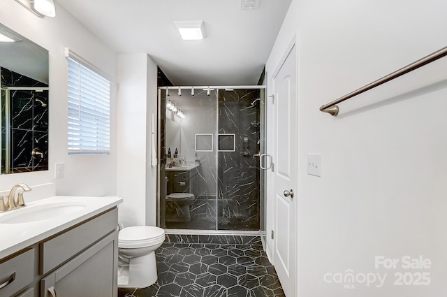 bathroom with toilet, a shower stall, visible vents, and vanity