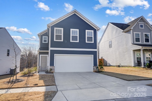 traditional-style home with a garage, concrete driveway, stone siding, and central AC unit