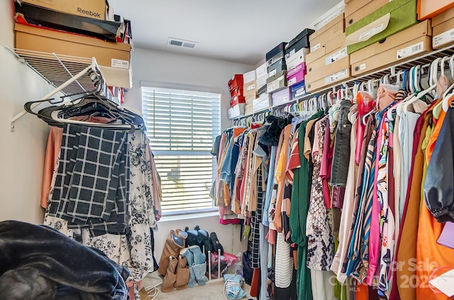 walk in closet with visible vents