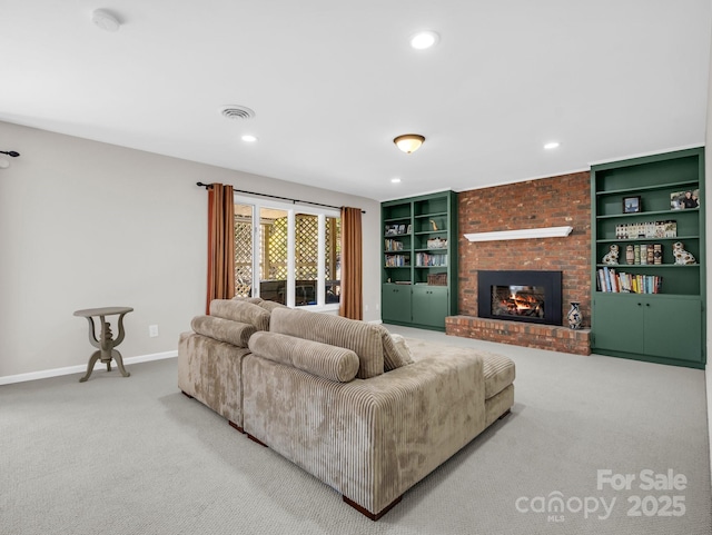 carpeted living area featuring recessed lighting, visible vents, built in features, baseboards, and a brick fireplace