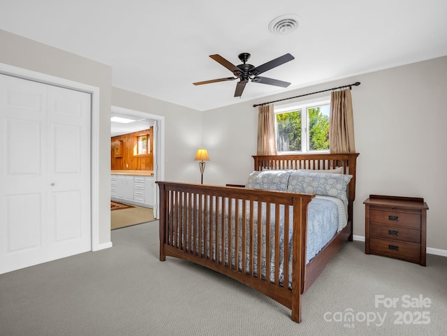 bedroom featuring carpet floors, visible vents, baseboards, and a ceiling fan