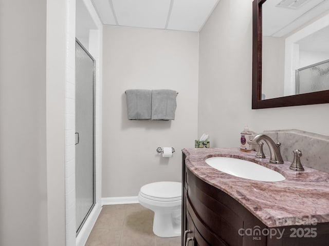 full bath featuring baseboards, toilet, tile patterned floors, vanity, and a shower stall