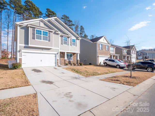 view of front of house with an attached garage, a residential view, stone siding, driveway, and a front lawn