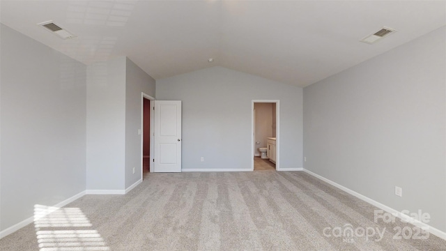 unfurnished bedroom with light carpet, visible vents, and baseboards