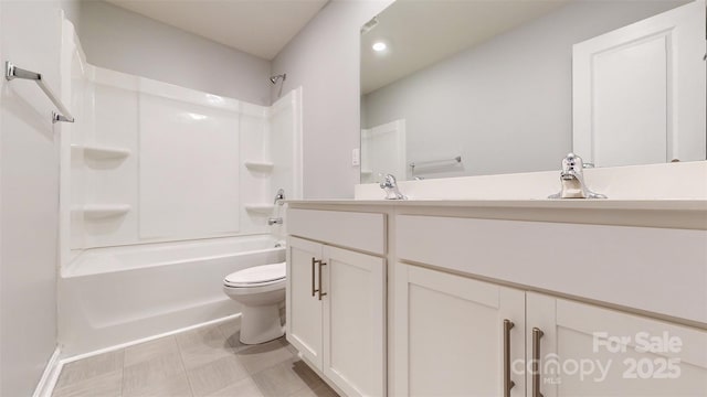 bathroom featuring  shower combination, toilet, and vanity