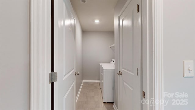 clothes washing area featuring laundry area and washer and dryer