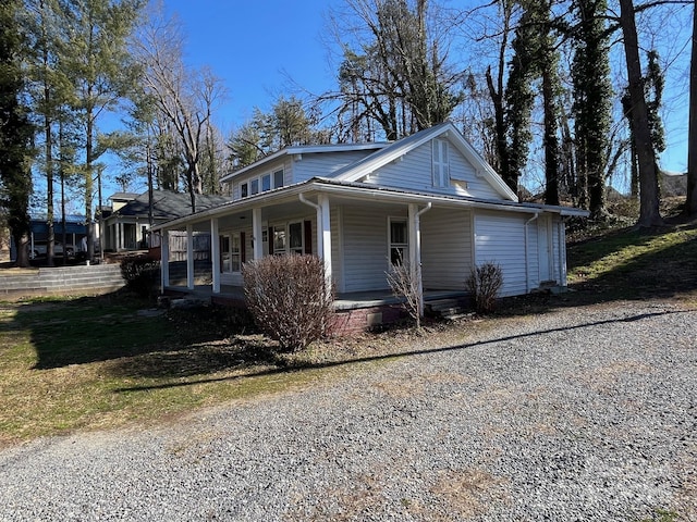 view of home's exterior featuring covered porch