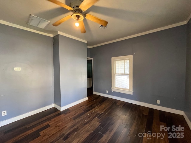 unfurnished room with ornamental molding, dark wood-type flooring, a ceiling fan, and baseboards