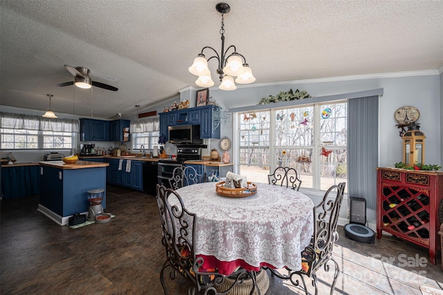 dining space with vaulted ceiling, a textured ceiling, ceiling fan with notable chandelier, and crown molding