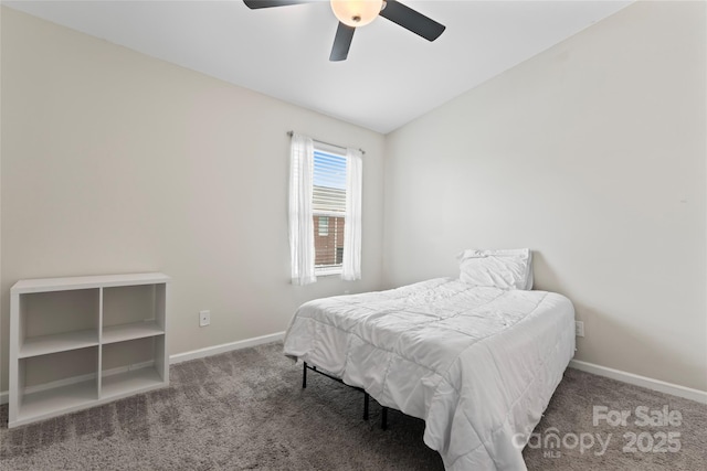 carpeted bedroom with ceiling fan, baseboards, and vaulted ceiling