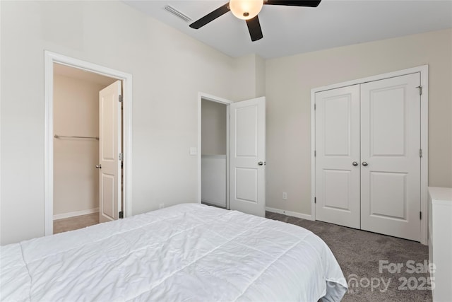 carpeted bedroom with visible vents, baseboards, a closet, and ceiling fan