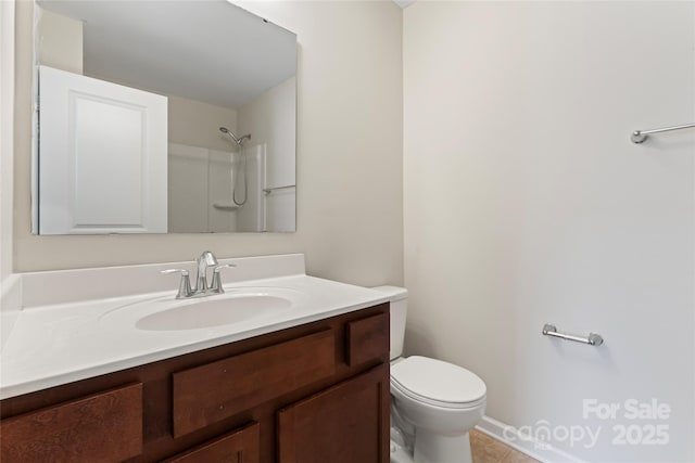 full bathroom with tile patterned floors, toilet, vanity, and walk in shower