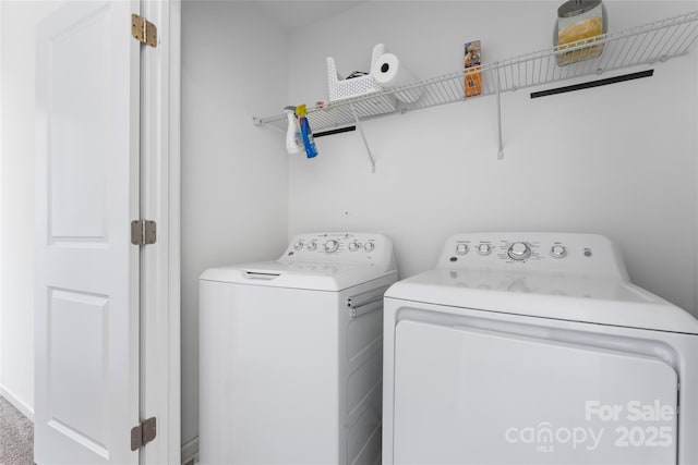 laundry room featuring laundry area and washing machine and clothes dryer