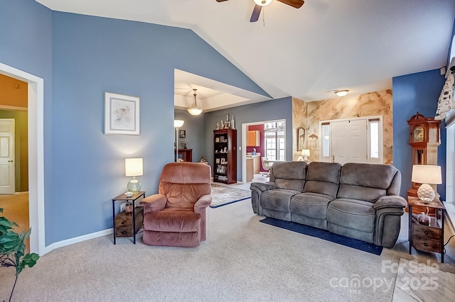 carpeted living area featuring a ceiling fan, lofted ceiling, and baseboards