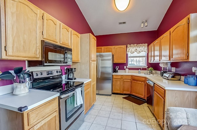 kitchen featuring a sink, visible vents, stainless steel appliances, and light countertops