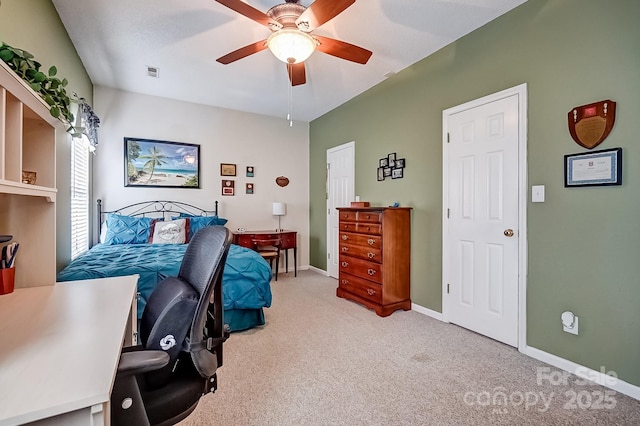 carpeted bedroom featuring visible vents, baseboards, and ceiling fan