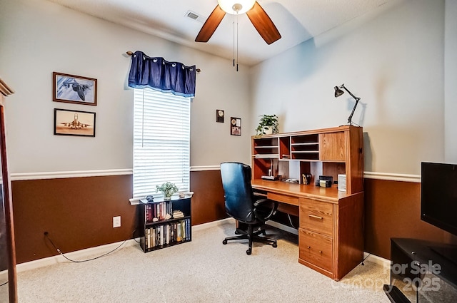 office with light colored carpet, ceiling fan, visible vents, and baseboards