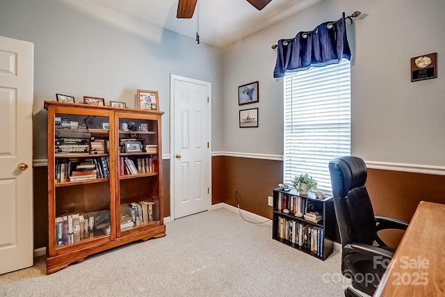 home office featuring carpet floors, baseboards, and a ceiling fan