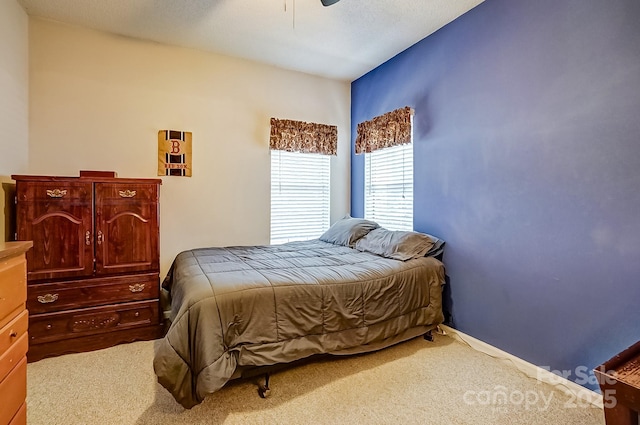 bedroom featuring carpet, ceiling fan, and baseboards