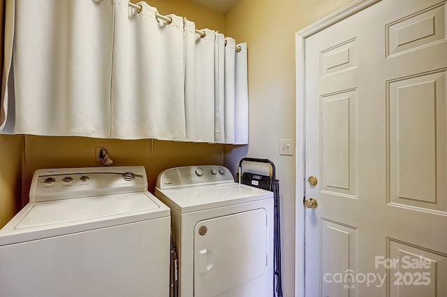 laundry area featuring laundry area and washer and clothes dryer