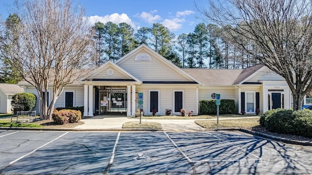 view of property featuring uncovered parking