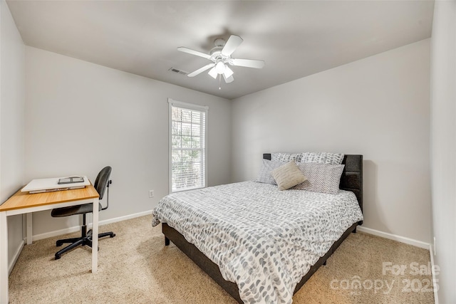 bedroom with carpet floors, ceiling fan, visible vents, and baseboards