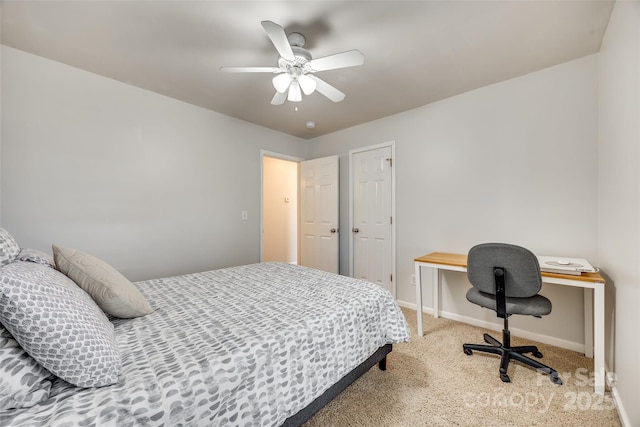 bedroom with ceiling fan, carpet floors, and baseboards