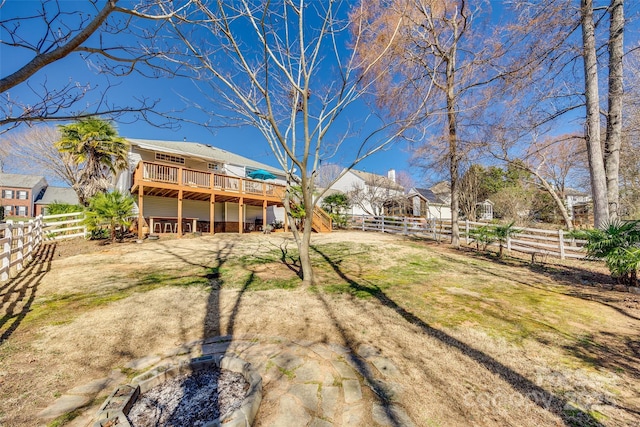 view of yard with a fenced backyard and a wooden deck