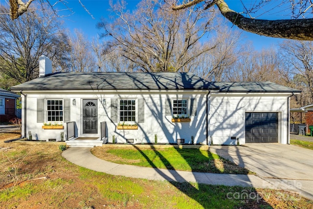 single story home featuring brick siding, a chimney, concrete driveway, crawl space, and a garage