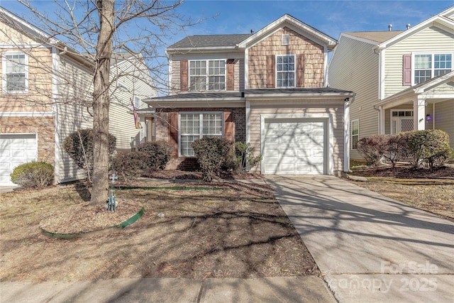 traditional-style home with driveway and an attached garage