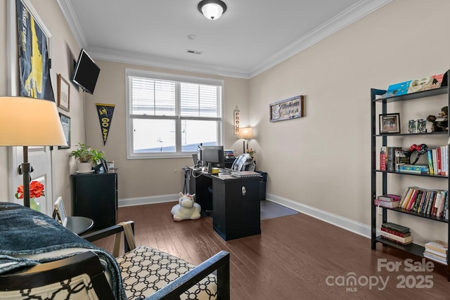 office area featuring wood-type flooring, visible vents, ornamental molding, and baseboards