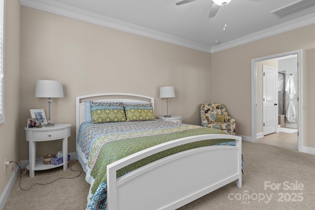 carpeted bedroom with visible vents, crown molding, baseboards, and ceiling fan