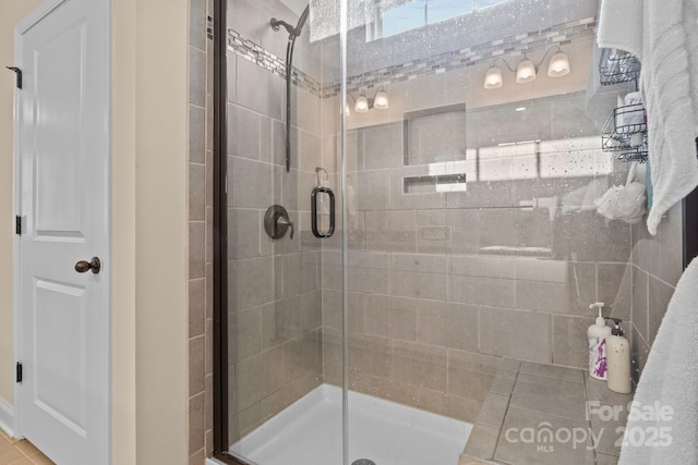 bathroom with a shower stall