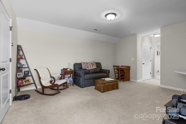 carpeted living room with lofted ceiling, visible vents, and baseboards