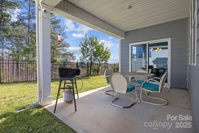 view of patio / terrace featuring outdoor dining space and fence