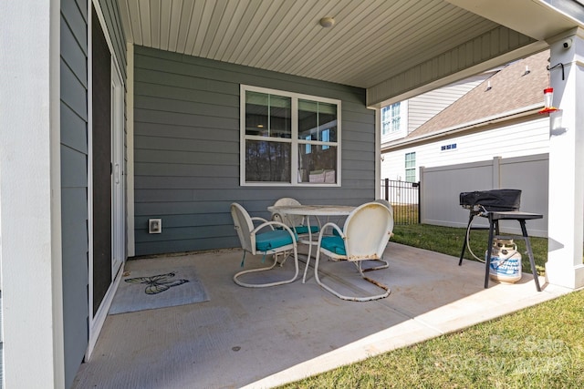 view of patio / terrace featuring fence