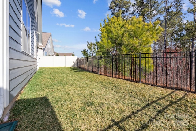 view of yard with a fenced backyard