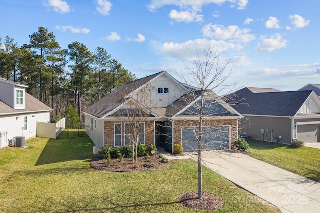 view of front of home featuring a front lawn, concrete driveway, fence, and an attached garage