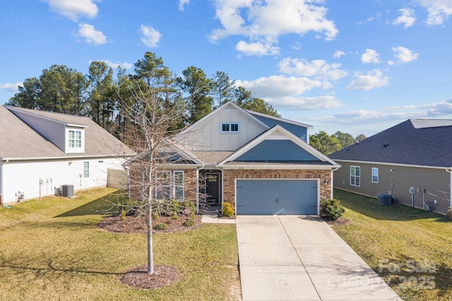 view of front of property with a front yard, central AC unit, board and batten siding, and concrete driveway