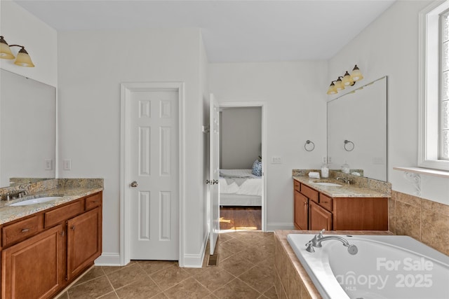 ensuite bathroom with ensuite bathroom, a sink, a garden tub, tile patterned flooring, and two vanities