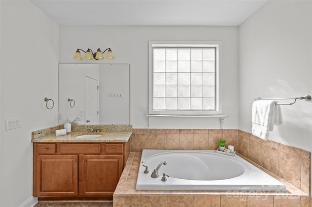 full bathroom with vanity and a bath