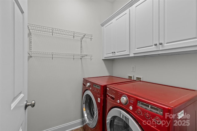 laundry area with cabinet space and washing machine and clothes dryer