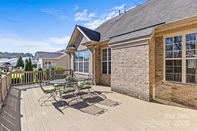 deck with outdoor dining space