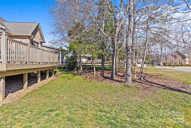 view of yard with a wooden deck