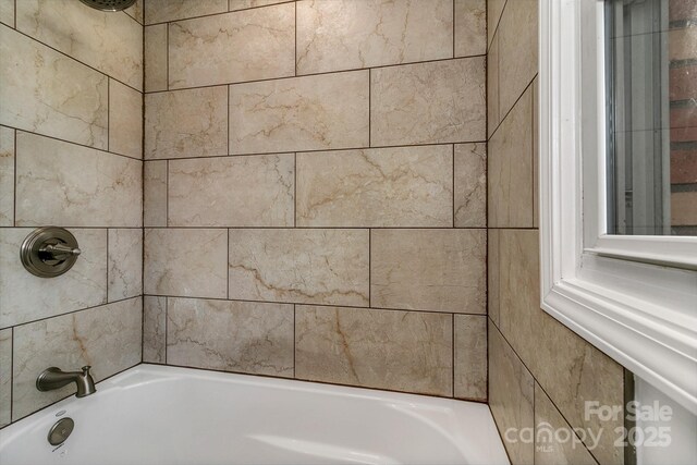 full bathroom with shower / washtub combination