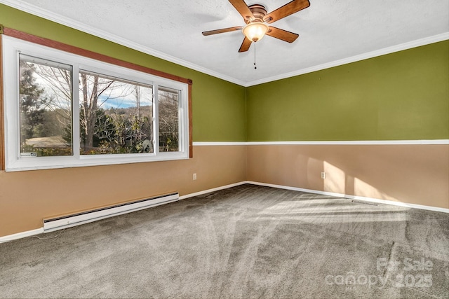 carpeted empty room with crown molding, baseboards, ceiling fan, baseboard heating, and a textured ceiling