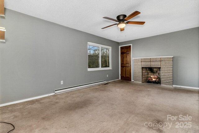 unfurnished living room with a textured ceiling, a brick fireplace, carpet flooring, and a baseboard radiator